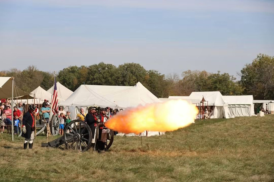 Costumed reenactors firing a cannon at the trade fair at Johnston Farm (photo courtesy of Piqua’s Johnston Farm & Indian Agency)