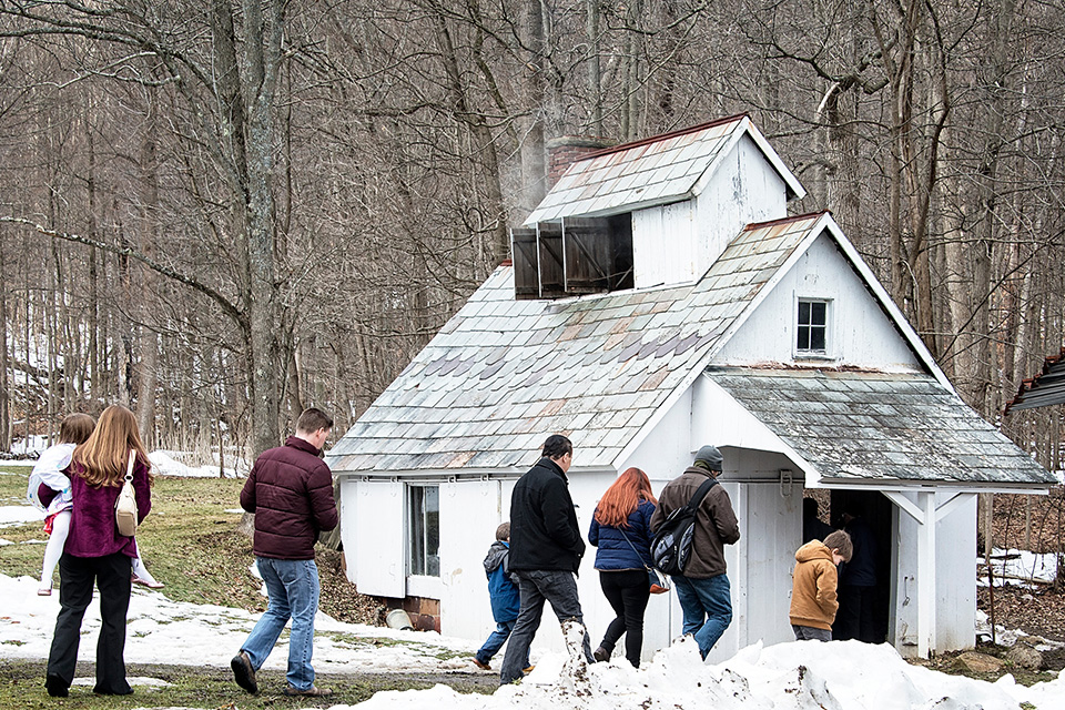 Group of people walking to C.O. Hale’s 1910 Sugar House at Hale Farm and Village (photo courtesy of Hale Farm and Village)