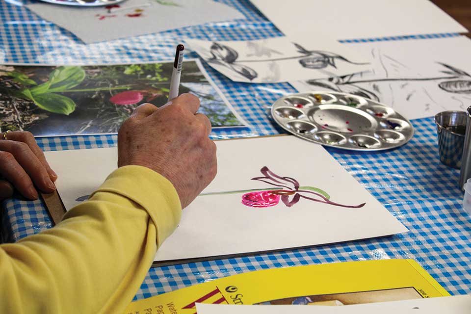 Person drawing at Watercolor & Ink Botanical Class at Centerville’s Activity Park (photo courtesy of Centerville-Washington Park District)