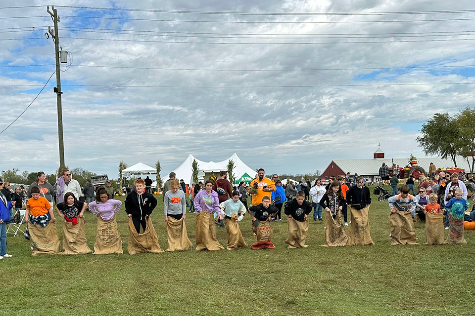 Kids doing sack races at Weber Pumpkin Festival in Harrison (photo courtesy of Weber Pumpkin Festival)