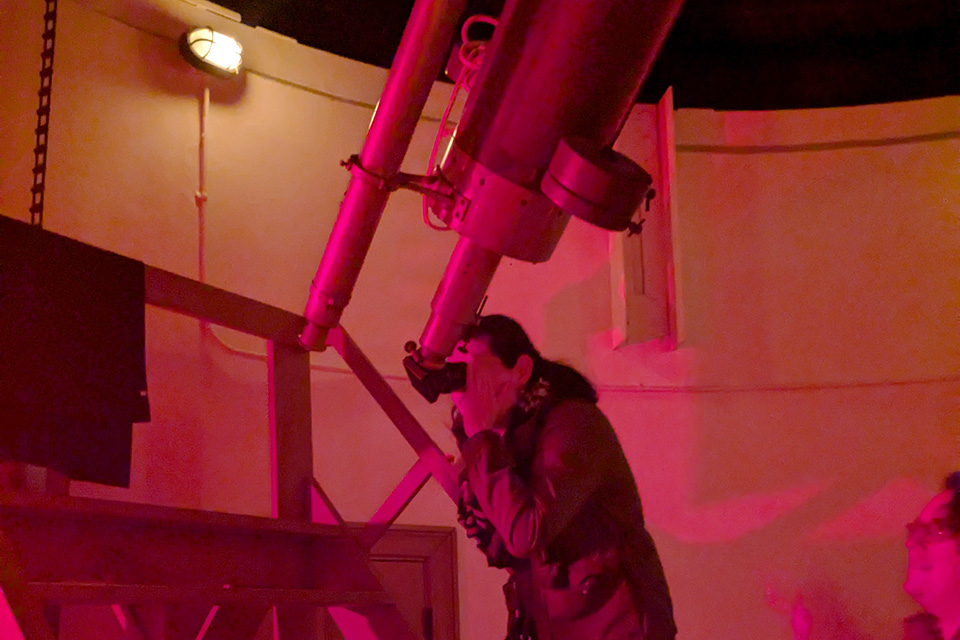 Person looking at telescope at Cincinnati Observatory (photo courtesy of Cincinnati Observatory)