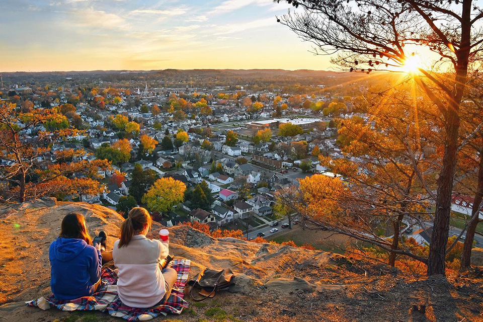 Two people watching the sunset at Mount Pleasant in Lancaster, Ohio (photo courtesy of Visit Fairfield County)