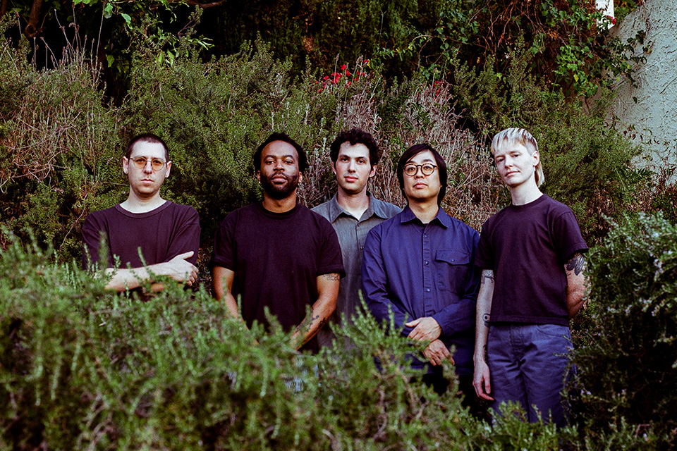 SML jazz quintet members standing next to each other in a field (photo by Charlie Weinmann; courtesy of the Wexner Center for the Arts)