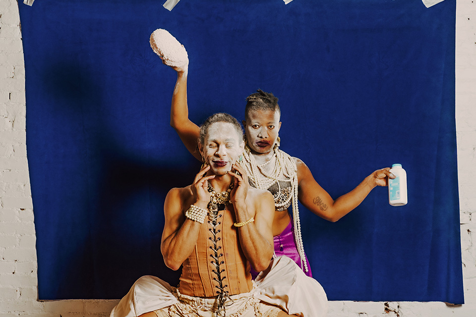 Two cast members of production of ”we come to collect: a flirtation, with capitalism“ (photo courtesy of the Wexner Center for the Arts)