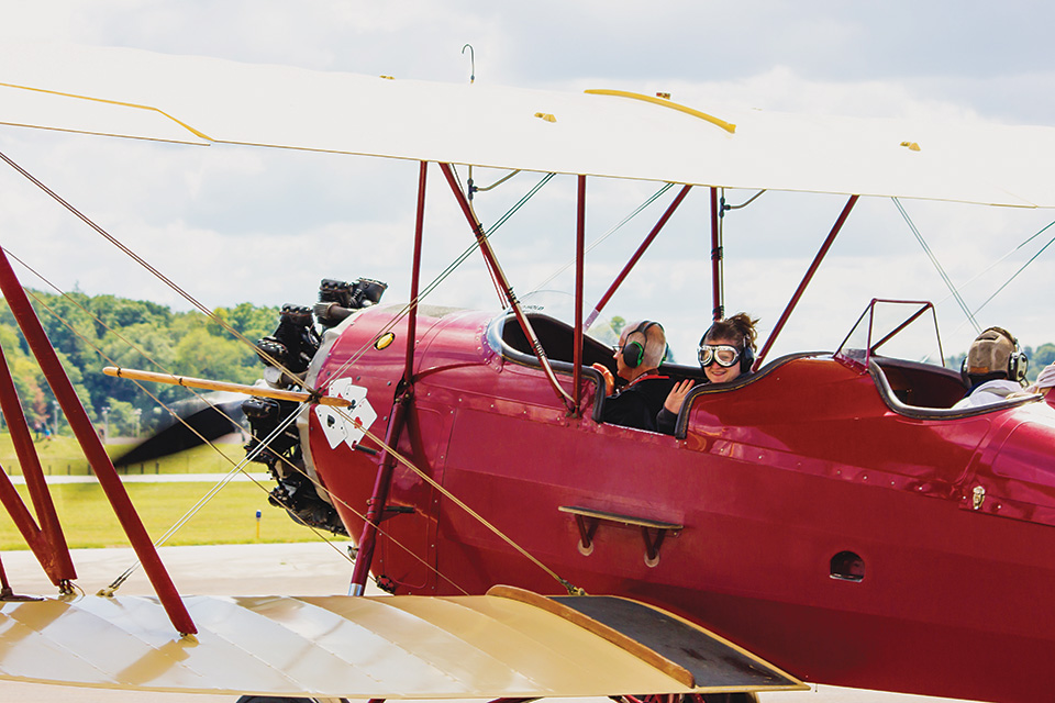 People in plane at Props & Pistons Festival in Akron (photo by Lauren Delgado)