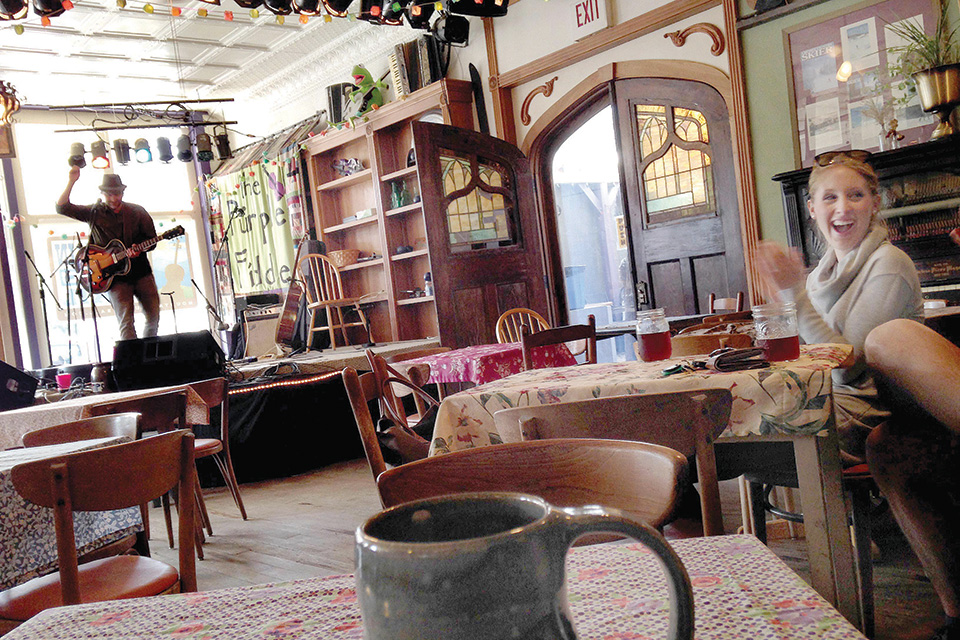 Person performing at The Purple Fiddle in Thomas, West Virginia (photo courtesy of The Purple Fiddle)
