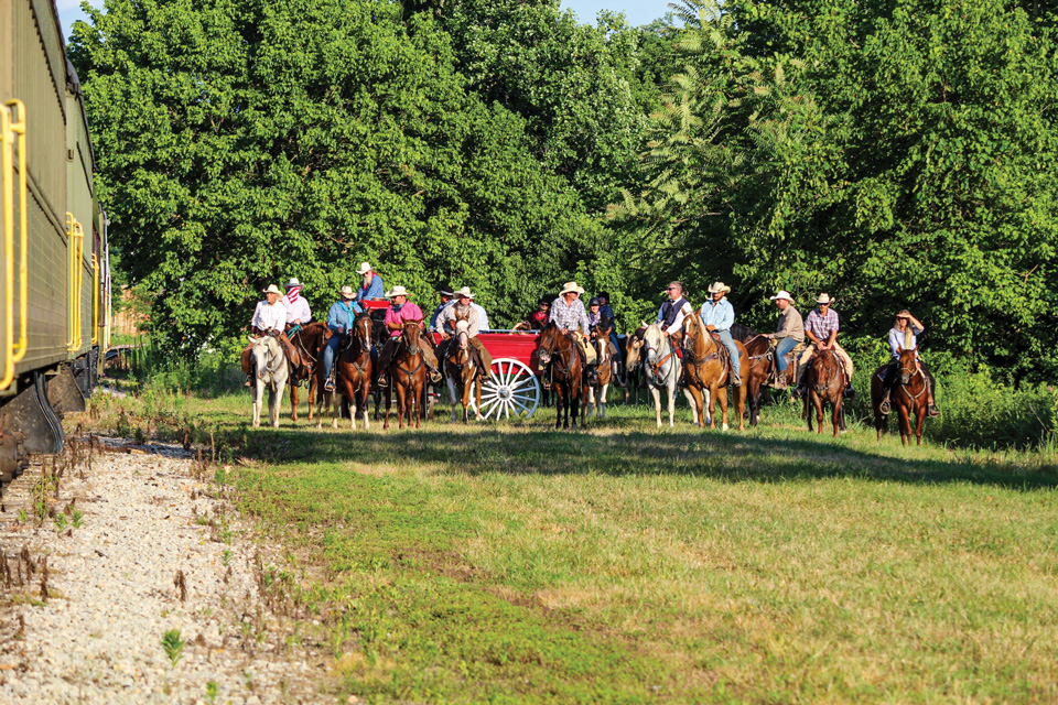 Men on horseback lined up for Hocking Valley Scenic Railway’s Ohio’s Friendliest Train Robbery in Nelsonville (photo by Isaac Miller)