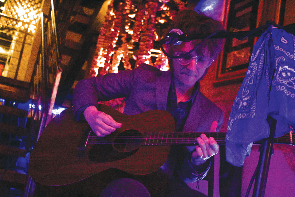 Man playing guitar at Revel OTR in Cincinnati (photo courtesy of Revel OTR)