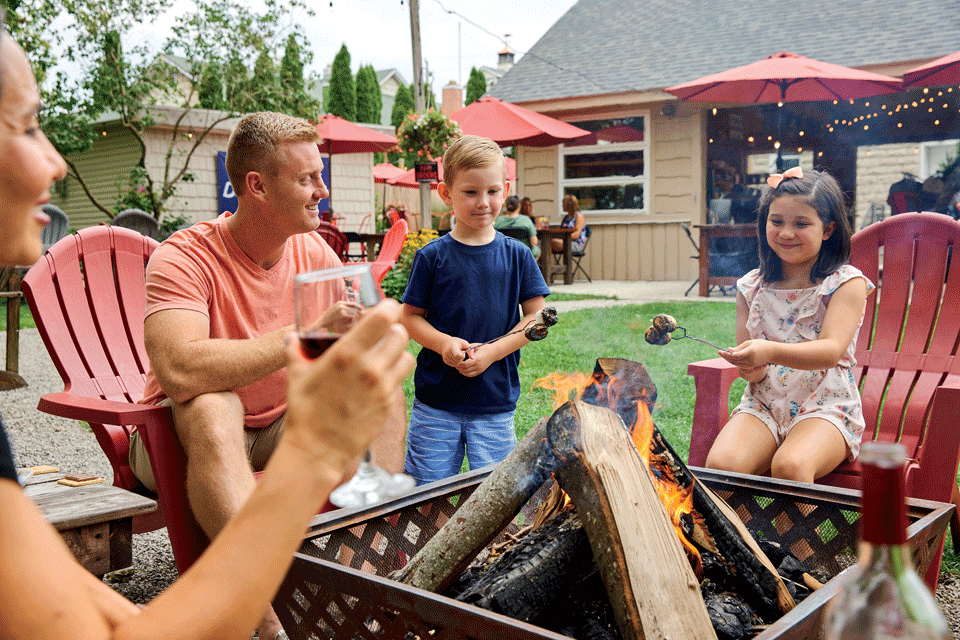 Family roasting marshmallows at Rocky Point Winery in Marblehead (photo by Kevin Kopanski)