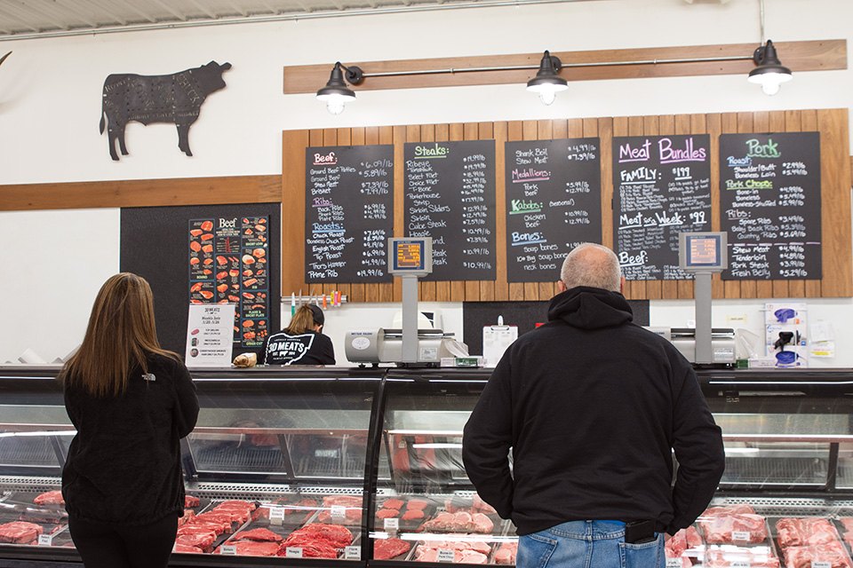 Customers ordering at the counter at 3D Meats in Dalton (photo by Rachael Jirousek)