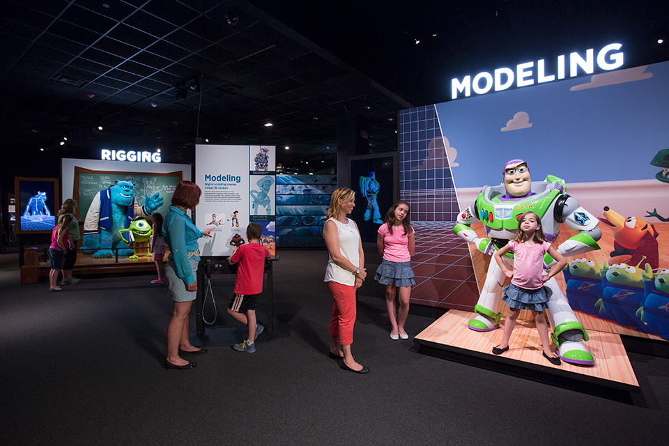 Kids and moms at “The Science Behind Pixar” exhibit at COSI in Columbus (photo courtesy of COSI)
