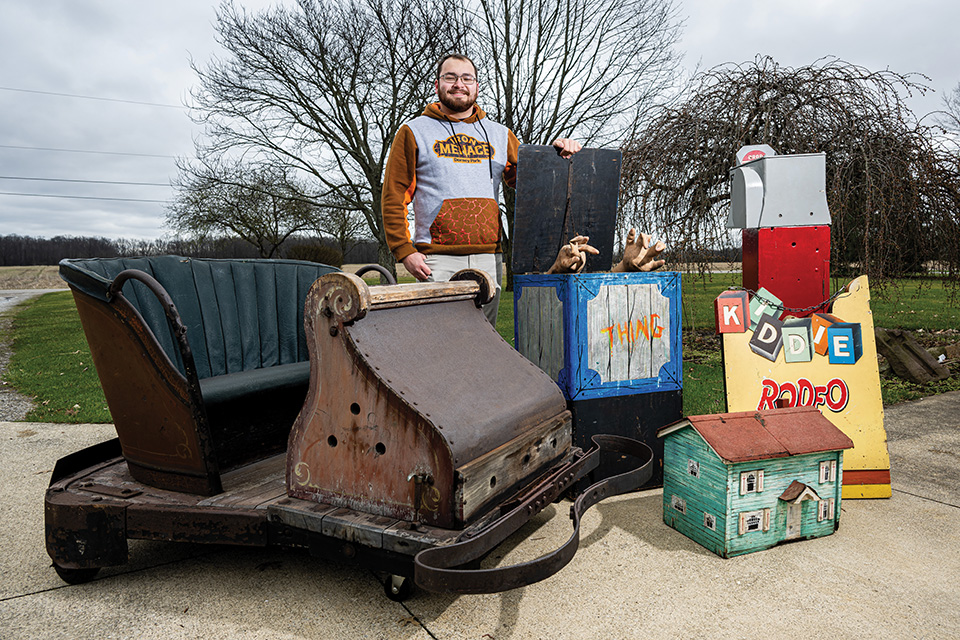 Amusement park preservationist Troy Parsh with memorabilia at Grafton home (photo by Ken Blaze)