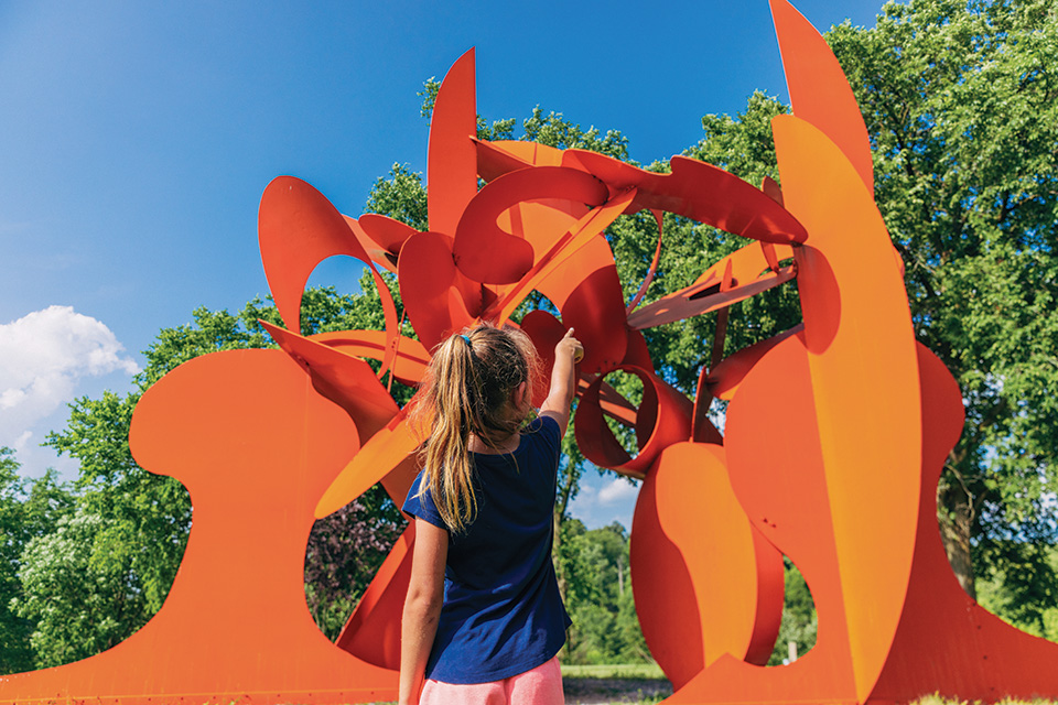 Girl at Pyramid Hill Sculpture Park in Hamilton (photo courtesy of Travel Butler County)