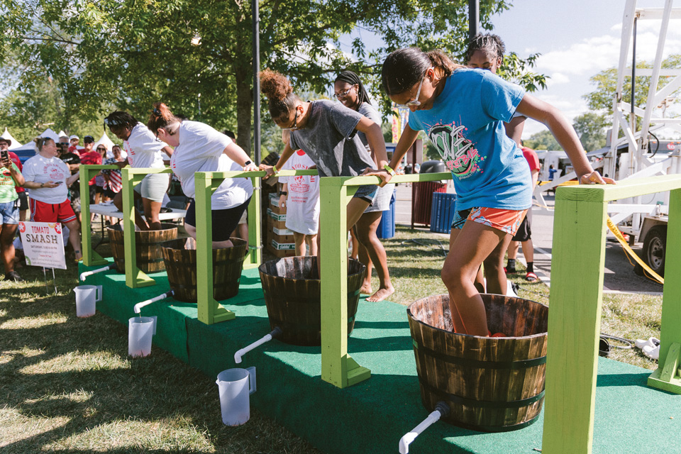People stomping tomatoes at the Tomato Festival in Reynoldsburg (photo by Robb McCormick)