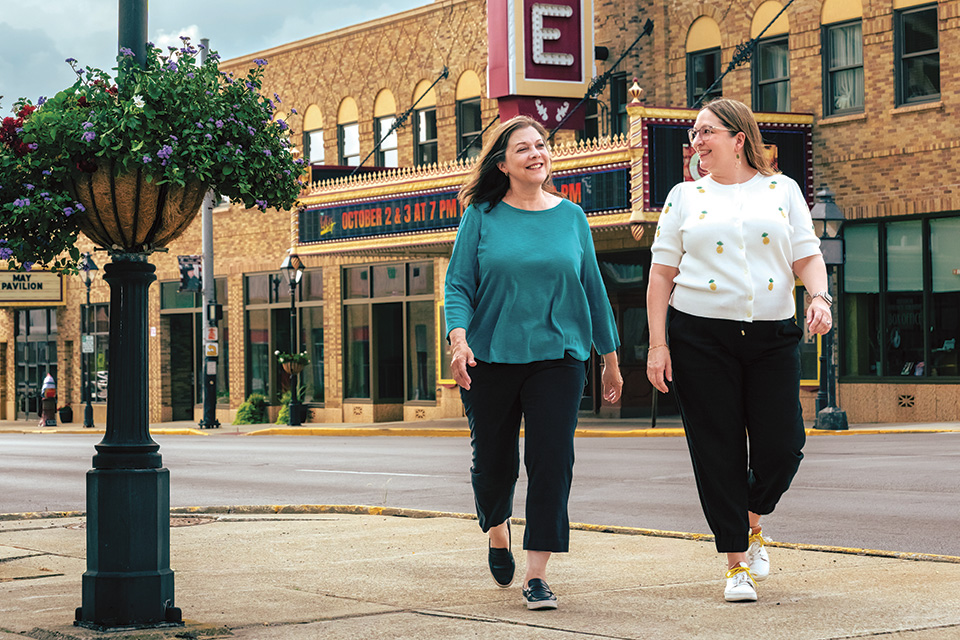 Women walking outside the Palace Theatre in downtown Marion (photo by Doug Hinebaugh)