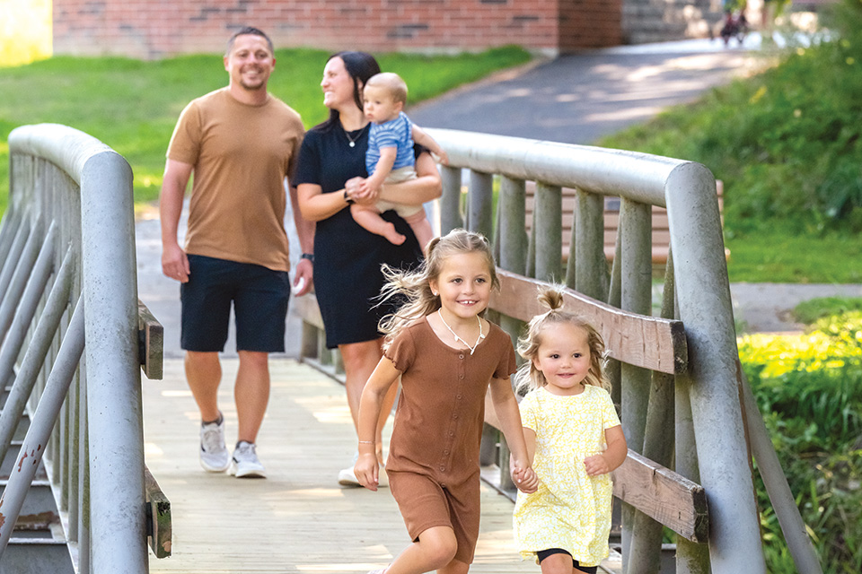 Family walking on bridge in Tiffin (photo by Doug Hinebaugh)