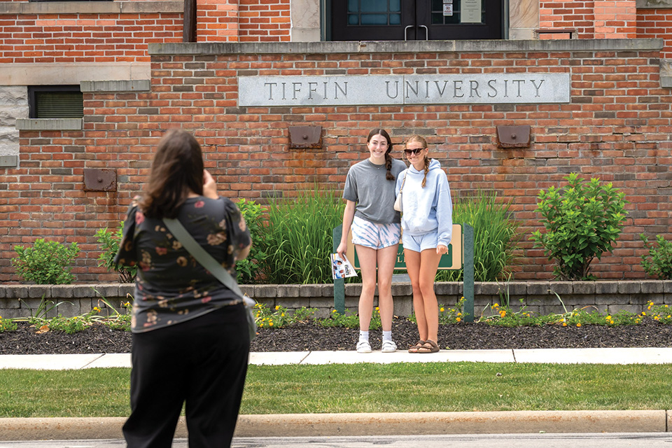 Women posing on campus at Tiffin University (photo by Doug Hinebaugh)