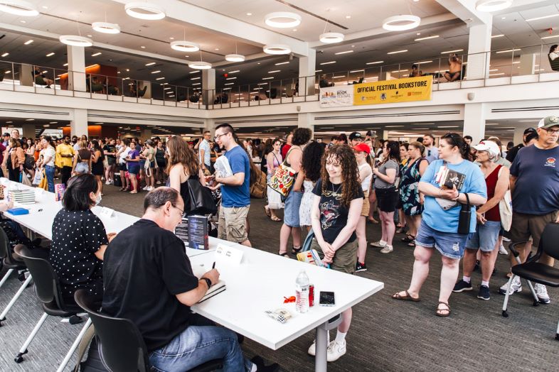 2025 Columbus Book Fair authors signing books